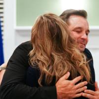 Dr. Ceglarek hugging wife